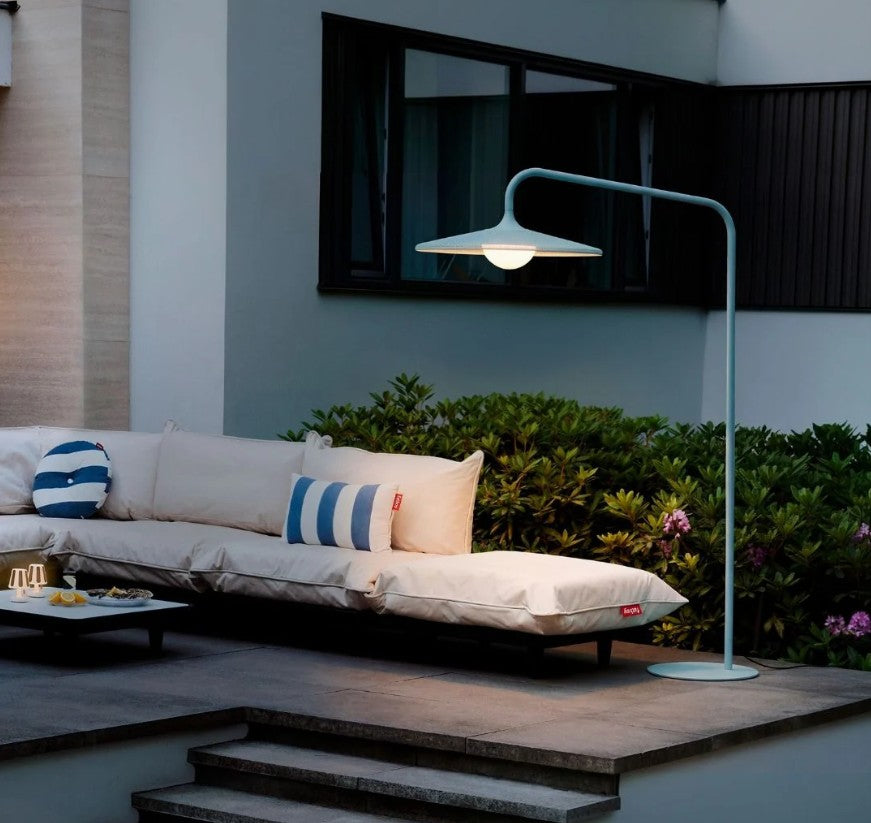 Fatboy Archigrande floor lamp styled with the Paletti modular sofa in an outdoor patio.